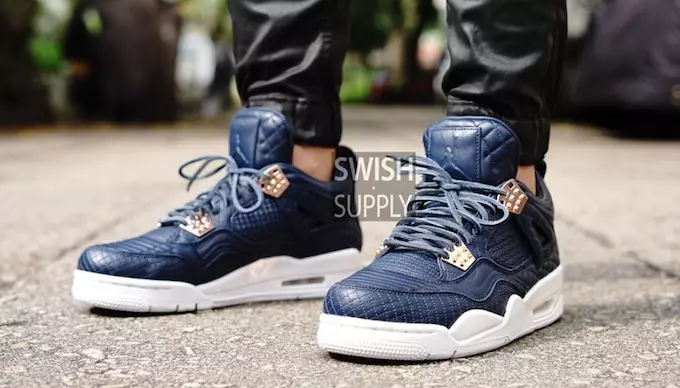 Ayaklarda Air Jordan 4 Premium Obsidyen Kuzu Derisi