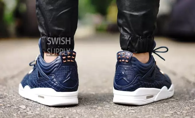 Air Jordan 4 Premium Obsidian Lamm Haut op Féiss