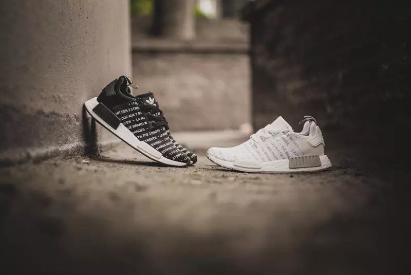 Adidas NMD -merkki, jossa on The Three Stripes Blackout Whiteout